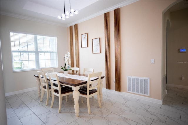 dining area featuring an inviting chandelier and crown molding