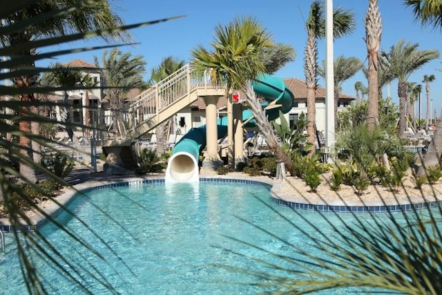 view of pool with a water slide