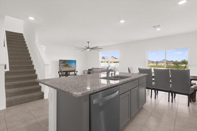 kitchen with a center island with sink, sink, a healthy amount of sunlight, and stainless steel dishwasher