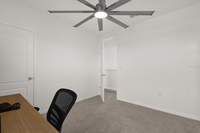 unfurnished office with ceiling fan and light colored carpet