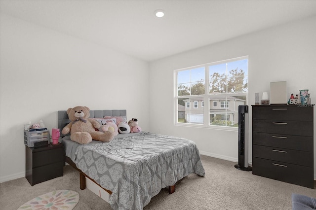 bedroom with light colored carpet