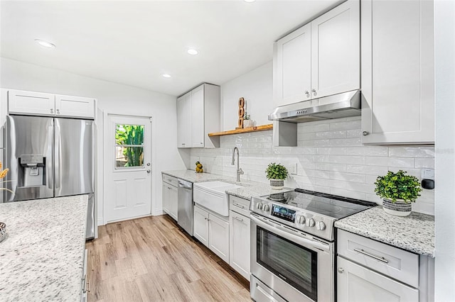 kitchen with white cabinets, appliances with stainless steel finishes, and sink