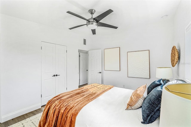 bedroom with ceiling fan and hardwood / wood-style floors