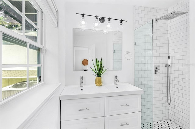 bathroom featuring an enclosed shower and vanity