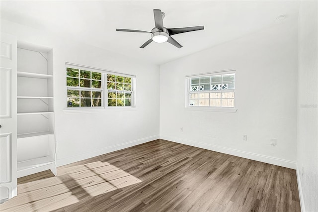 unfurnished room featuring ceiling fan and hardwood / wood-style flooring