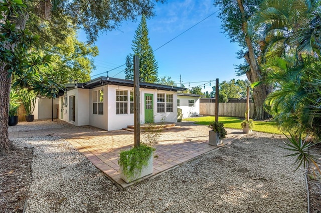 rear view of house with a patio area