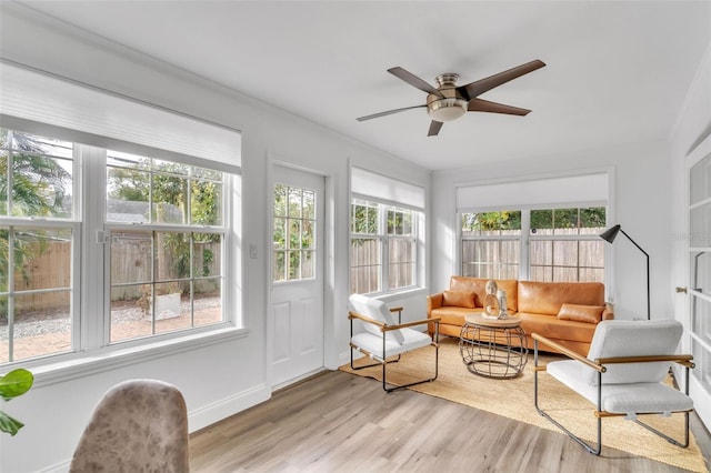 sunroom / solarium with ceiling fan and a wealth of natural light