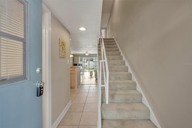 staircase featuring tile patterned floors