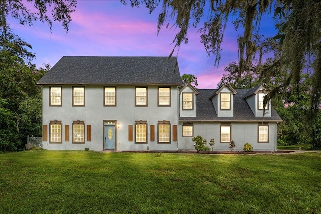 view of front of house featuring a lawn