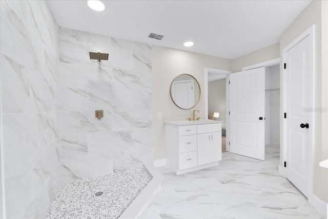 bathroom with a shower and vanity