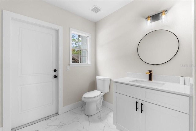 bathroom with vanity, baseboards, toilet, visible vents, and marble finish floor
