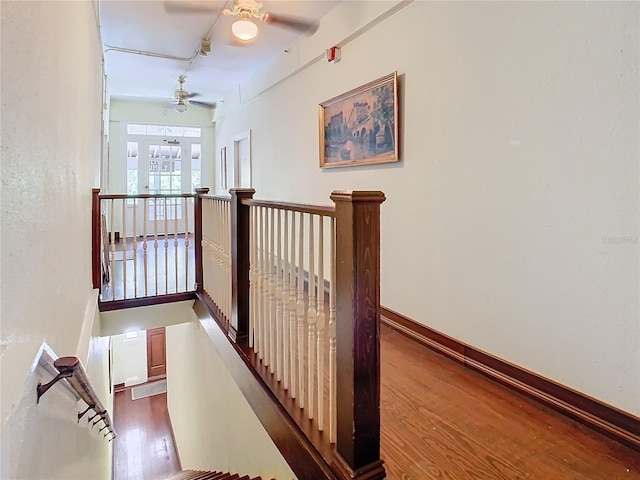 318 S Palmetto Ave, Sanford, FL 32771 - hallway with an upstairs landing, wood finished floors, and baseboards
