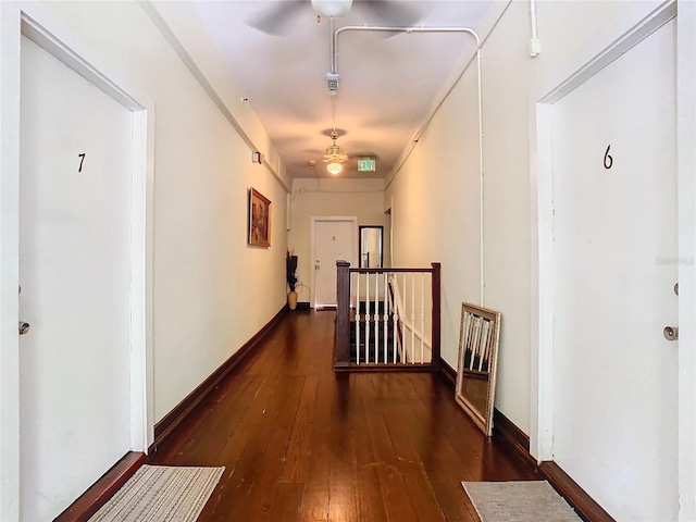 corridor with dark wood-type flooring