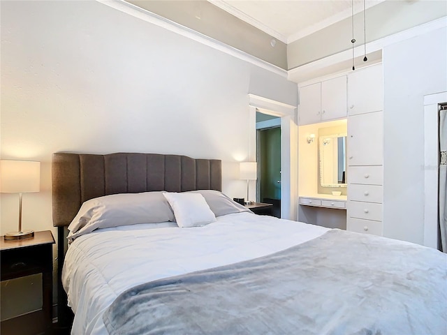 bedroom with ensuite bath and crown molding