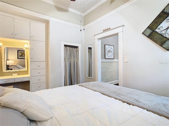 bedroom with ceiling fan and crown molding