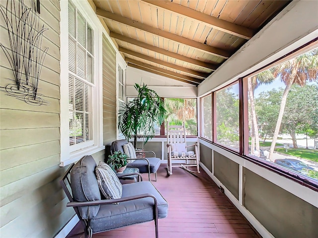 sunroom / solarium featuring wood ceiling and vaulted ceiling