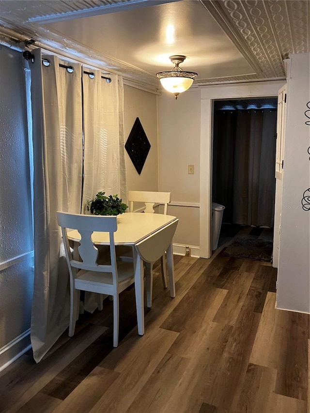 dining area featuring dark hardwood / wood-style flooring