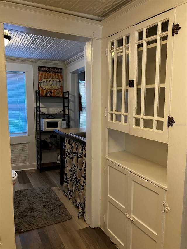 318 S Palmetto Ave, Sanford, FL 32771 - hall featuring dark wood-style floors and ornamental molding