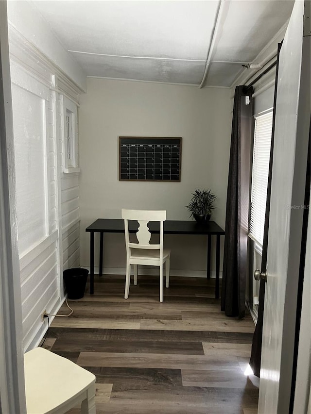 dining area featuring dark hardwood / wood-style floors