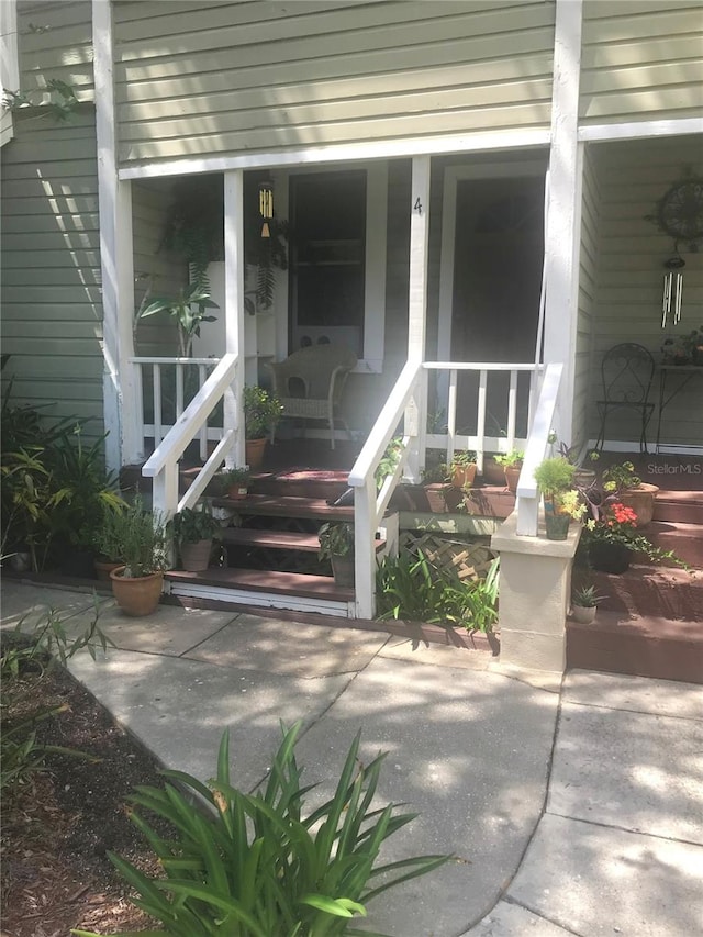 doorway to property with a porch