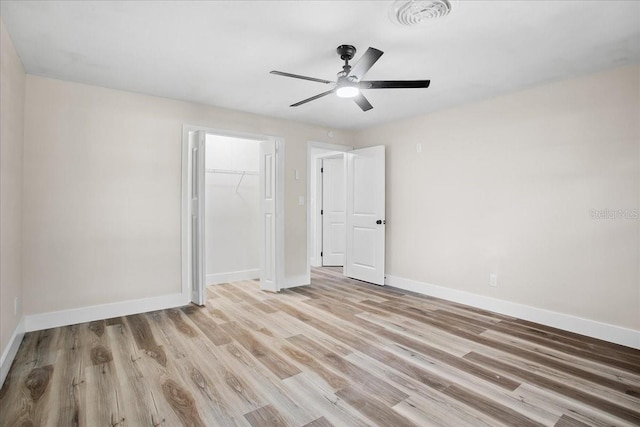 unfurnished bedroom with visible vents, baseboards, a ceiling fan, light wood-type flooring, and a closet