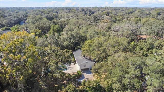 drone / aerial view with a view of trees