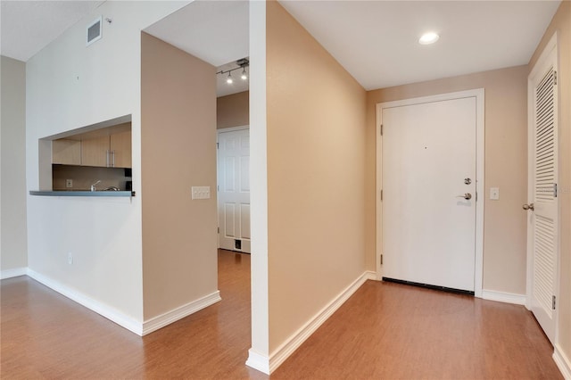 entrance foyer with light hardwood / wood-style flooring