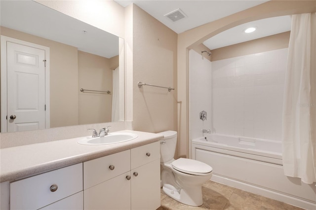 full bathroom featuring shower / tub combo with curtain, tile patterned floors, vanity, and toilet