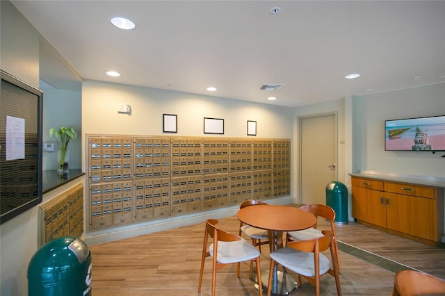 dining space with light hardwood / wood-style floors