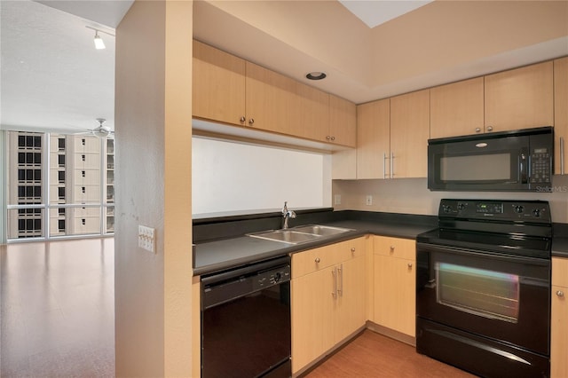 kitchen featuring light brown cabinetry, black appliances, sink, and ceiling fan