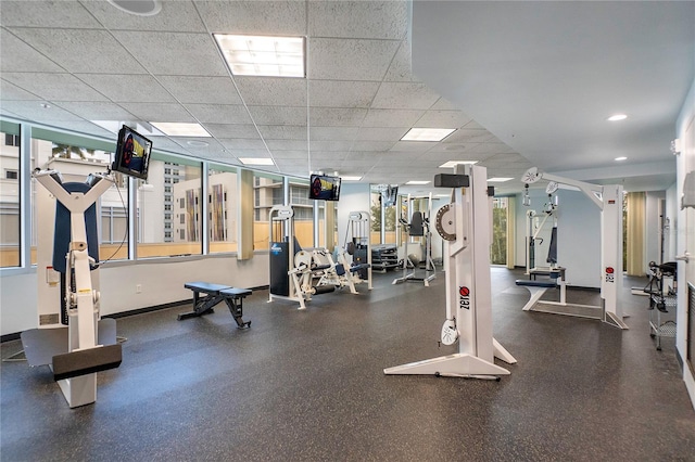 gym featuring recessed lighting and baseboards