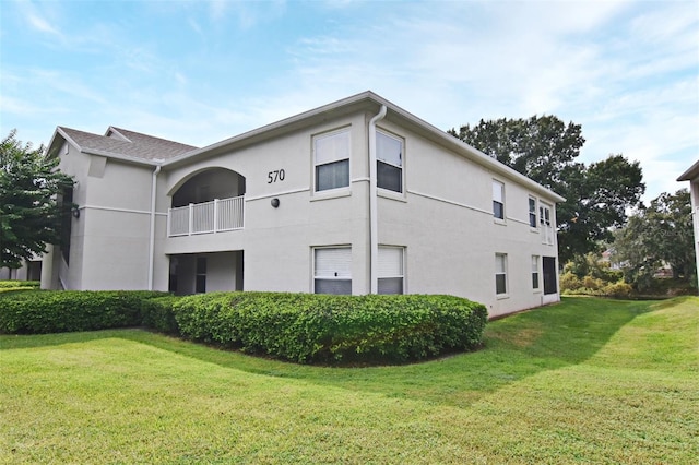 view of side of property with a yard