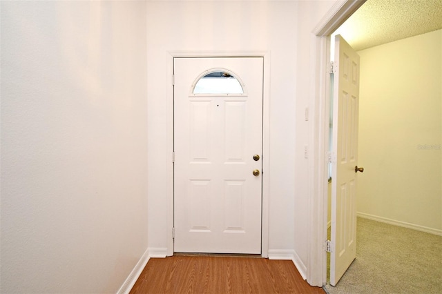 570 Cranes Way Unit 248, Altamonte Springs, FL 32701 - entryway with baseboards and wood finished floors