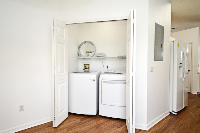 570 Cranes Way Unit 248, Altamonte Springs, FL 32701 - laundry room with washer and clothes dryer, wood finished floors, electric panel, and baseboards