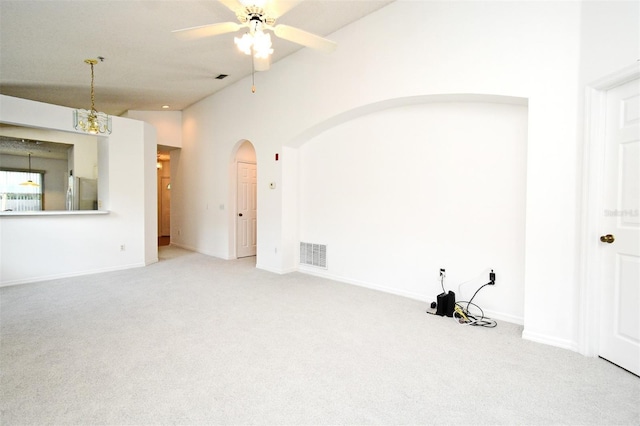 570 Cranes Way Unit 248, Altamonte Springs, FL 32701 - carpeted spare room with arched walkways, a ceiling fan, baseboards, and lofted ceiling