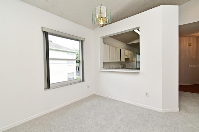 570 Cranes Way Unit 248, Altamonte Springs, FL 32701 - empty room featuring a chandelier, light colored carpet, and baseboards