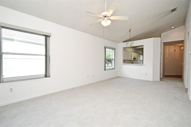 570 Cranes Way Unit 248, Altamonte Springs, FL 32701 - unfurnished room with lofted ceiling, light carpet, a ceiling fan, and baseboards