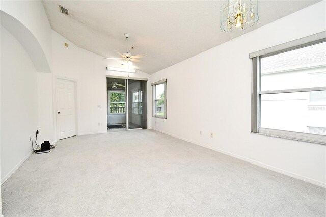 570 Cranes Way Unit 248, Altamonte Springs, FL 32701 - spare room featuring carpet, lofted ceiling, baseboards, ceiling fan, and a chandelier