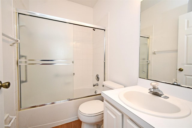 570 Cranes Way Unit 248, Altamonte Springs, FL 32701 - full bathroom with vanity, toilet, shower / bath combination with glass door, and wood finished floors
