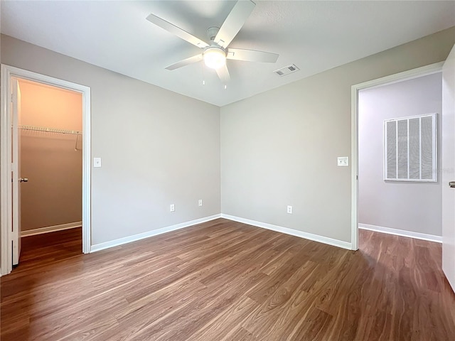 spare room featuring ceiling fan and hardwood / wood-style floors