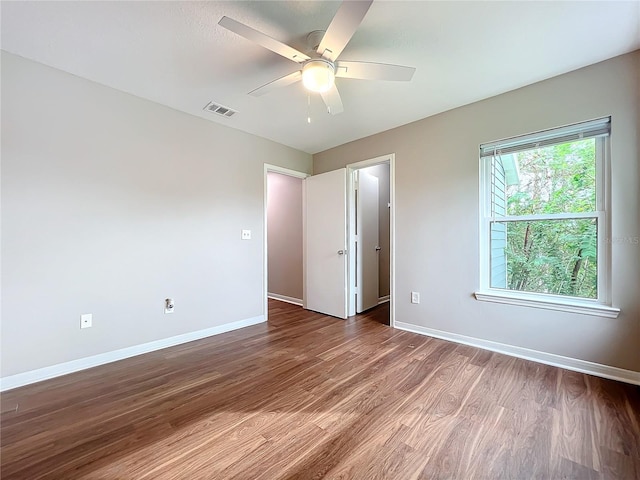 spare room featuring ceiling fan and hardwood / wood-style floors