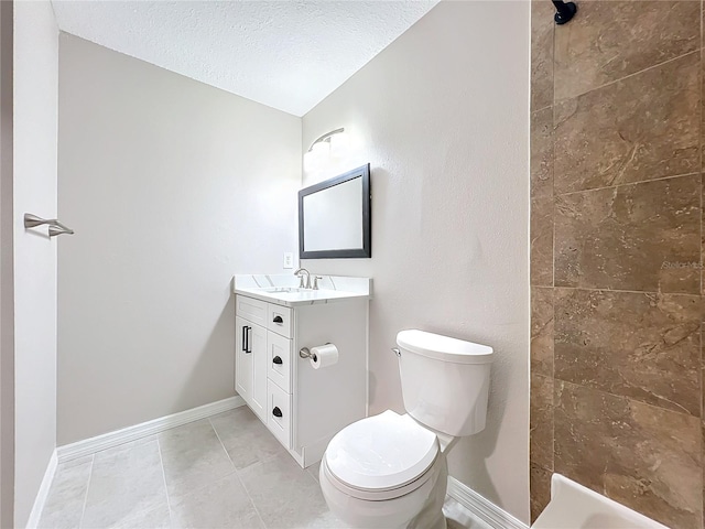 bathroom featuring vanity, a textured ceiling, lofted ceiling, tile patterned flooring, and toilet