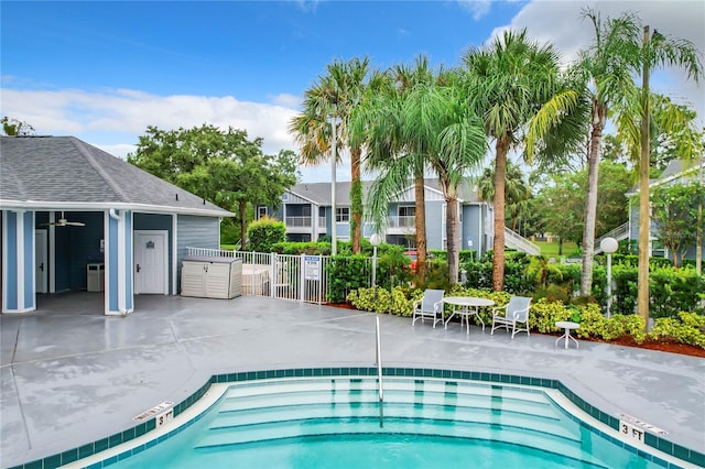 view of swimming pool with a patio