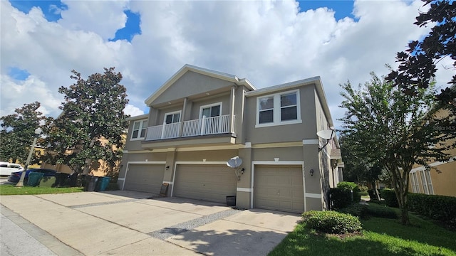 multi unit property featuring a balcony and a garage