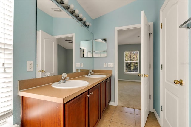 bathroom featuring tile patterned floors, vanity, ceiling fan, and vaulted ceiling