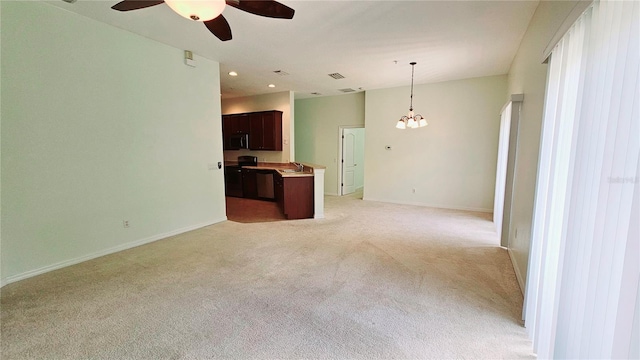 unfurnished living room with sink, light colored carpet, and ceiling fan with notable chandelier