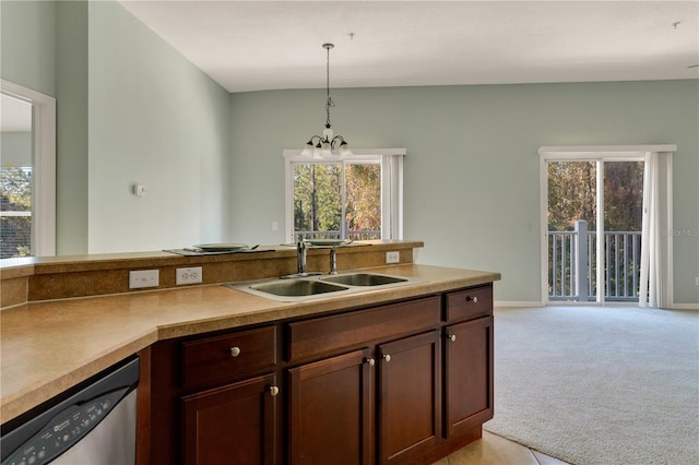 kitchen featuring pendant lighting, dishwasher, light carpet, sink, and a notable chandelier