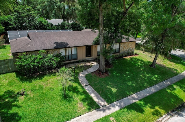 ranch-style home with a front lawn