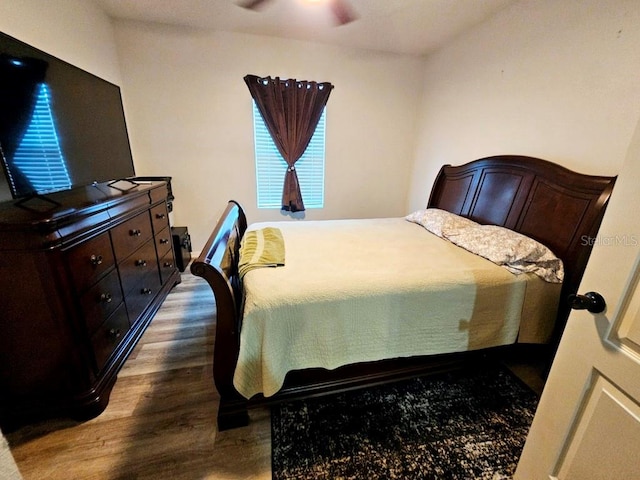 bedroom featuring ceiling fan and hardwood / wood-style flooring