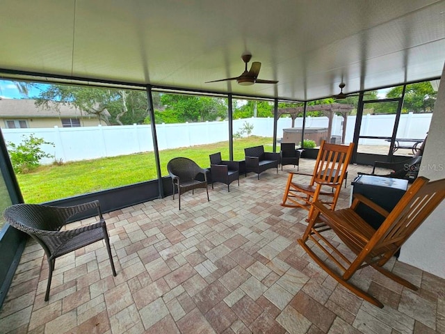 sunroom with ceiling fan and a healthy amount of sunlight